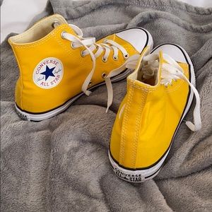 Yellow Converse shoes
